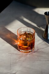 Photo of a Negroni cocktail with sun light and shadow