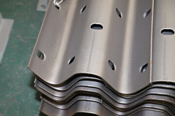 Sheet metal product after processing on a bending machine. Production of fastening from metal for construction.