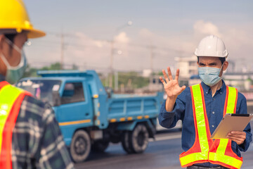 Fototapeta na wymiar Asian Engineer construction are worker employee working by safety control helmet on site building