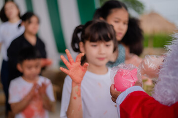 teacher and children playing color in Art join hand in hand fun together