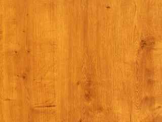 Texture of a wooden surface. Orange wooden material as part of an interior design. Close-up of a furniture part. Abstract empty background of a wall. Blank old board of a table or floor.