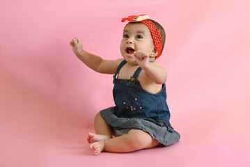 portrait of a baby little girl in a dress
