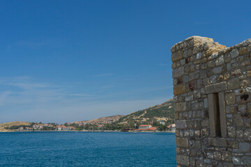 Beautiful Foça view from old Beşkapılar castle. Foça coast, sea, town, hills and residences on the background. Copy space for text.