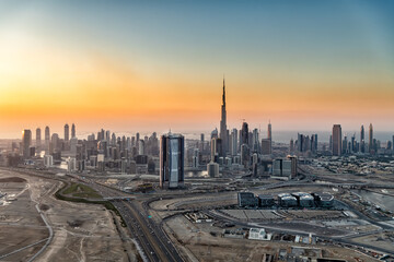 Naklejka na ściany i meble Aerial sunset view Dubai real estate investment expansion
