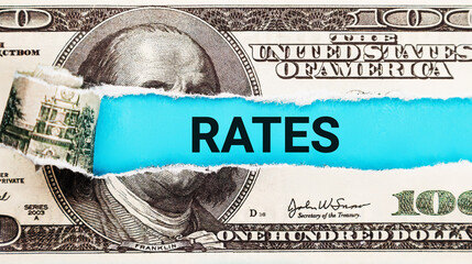 Rates The word rates on dollar usa background. Financial concept.