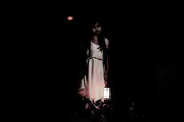 sad child ghost at night,Halloween  Festival concept,Friday 13th,Horror movie scene,A girl with doll