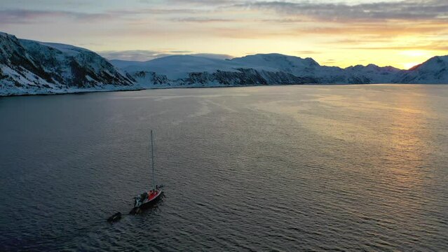 Beauty Sunset boat crossing Norwegian winter fjord heading Norway, Cruise to Patagonia. Landscape on Glacier Avenue, Cruise Ship Explorers of Patagonia, Chilean, Fjords. Patagonia, Strait of Magellan.