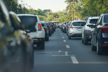 traffic. cars caught in the crowd. photo taken in the evening. people in traffic returning from work.