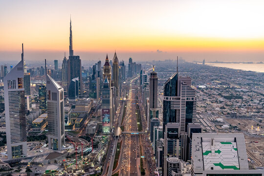 Aerial Dubai cityscape at sunset Sheikh Zayed Road