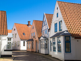 Danish old city street with cobbled streets and blue sky