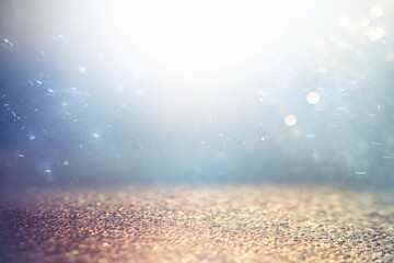 background of abstract gold, blue and silver glitter lights. defocused