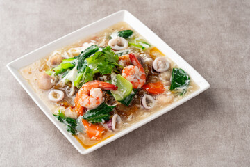 kwetiau siram is Chinese cuisine which is popular in Indonesia, cooked by frying added with complementary vegetables and chicken, seafood or beef meat and thick soup.