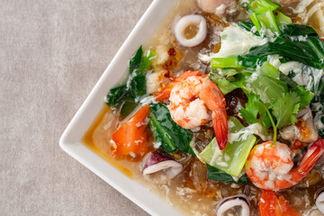 kwetiau siram is Chinese cuisine which is popular in Indonesia, cooked by frying added with complementary vegetables and chicken, seafood or beef meat and thick soup.