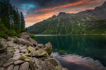 Amazing sunset in the Tatra Mountains above Eye of the Sea Lake, Poland - obrazy, fototapety, plakaty