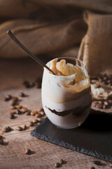 Close up of coffee milkshake with a metal spoon