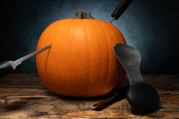 Halloween pumpkin carving tools for Jack-o'-lantern face cut out. Spoon gutter and saw blades, with...