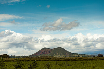 Fototapeta premium Landscape of a hill in Santa Maria Zacatepec, Puebla on a partly cloudy day