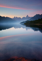 Fototapeta premium Lake landscape at sunset with glaciers, mountains and reflection