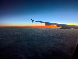 Fototapeta na wymiar early morning sunrise from an airplane