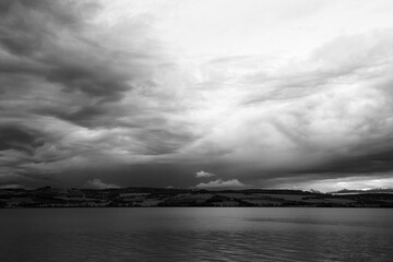 a cloudy and gloomy autumn evening above lake mjøsa