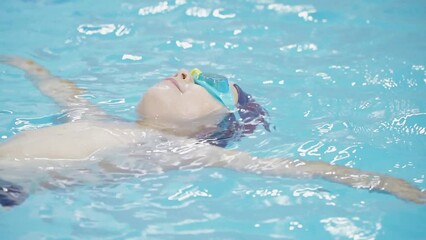Boy lying on the pool