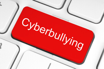 Fototapeta premium Red button with Cyberbullying word on the keyboard, technology concept