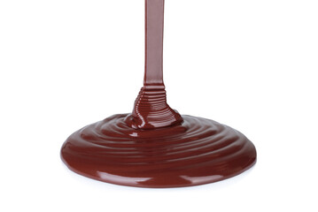 Melted chocolate dripping on white background