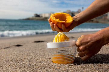 Freshly squeezed orange juice against the backdrop of the ocean