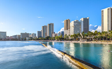 Fototapeta na wymiar Ocean Water, Waikiki Beach, and Hotel Towers