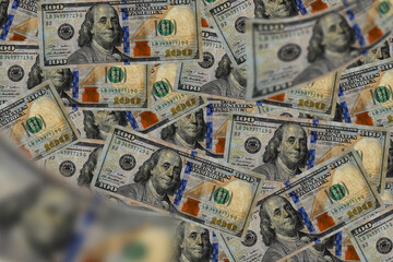 Group of money stack of 100 US dollars banknotes a lot of the background texture top view