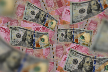 American 100 dollar flying banknote isolated on rupiah background