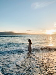 Person on beach during sunset in Hawaii