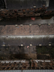 Old generic derelict industrial buildings in a dilapidated state aerial view