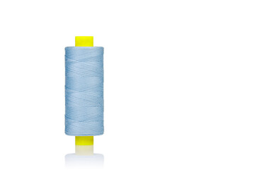 a skein of threads of blue color macro on a white background