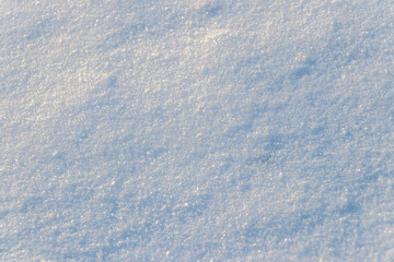 The texture of the snow-covered ground surface. Snow texture
