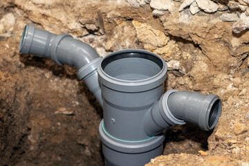 Obraz premium Installation of plastic sewer pipes in the bathroom