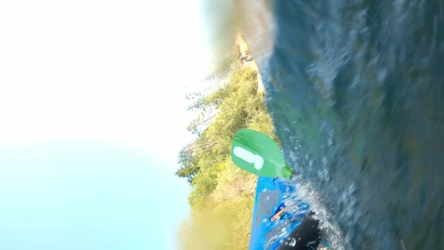 POV kayaker capsized into the river while paddling in a kayak, point of view shot.