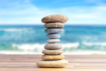 Fototapeta na wymiar Stacked pebbles to make shape of hourglass as a symbol of time management. Concept of meditation, slow down and controlling time.