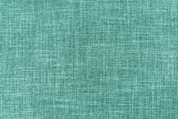 Texture of natural turquoise upholstery fabric or cloth. Fabric texture of natural cotton or linen textile material. Canvas background. Decorative fabric for curtain, furniture, walls, clothes