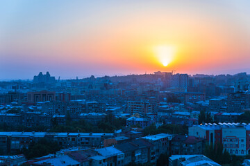 buildings in city at the sunset