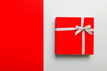 holiday handmade present tied gray ribbon bow top view with copy space. Flat lay holiday background. Birthday or christmas present. Christmas gift box concept with copy space