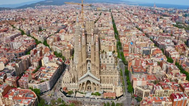 Top aerial view panorama cityscape landmark old Barcelona city Spain summer historical buildings old constructions of monumental catholic historical church La Sagrada Familia cathedral drone shooting