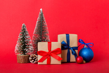 Christmas composition. Gifts, small tree, branches and craft DIY decorations on white background. New year concept. Christmas home decoration Flat lay, top view, copy space