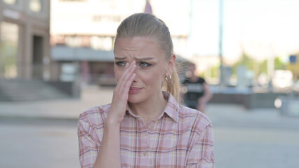 Portrait of Sad Young Woman Crying Outdoor