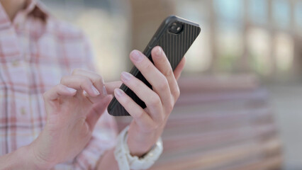Close Up of Woman Using Smartphone Outdoor