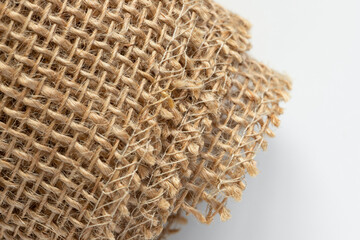 Roll of burlap natural fabric. Close up texture of decorative sackcloth