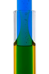 Abstract macro shot of colored water in two test tubes