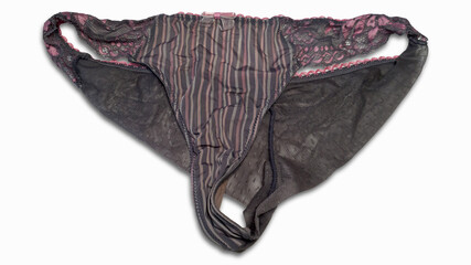 Striped women's lace panties with a pink bow isolated on a white background. Elegant thong close-up. Fashion underwear