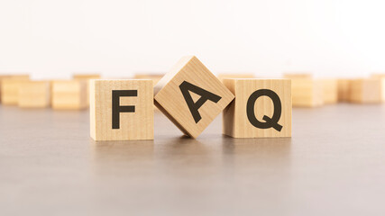 text FAQ is made of wooden blocks on gray background