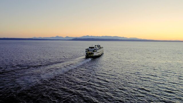 Stunning Washington Travel Aerial of Ferry Boat and Olympic Mountains